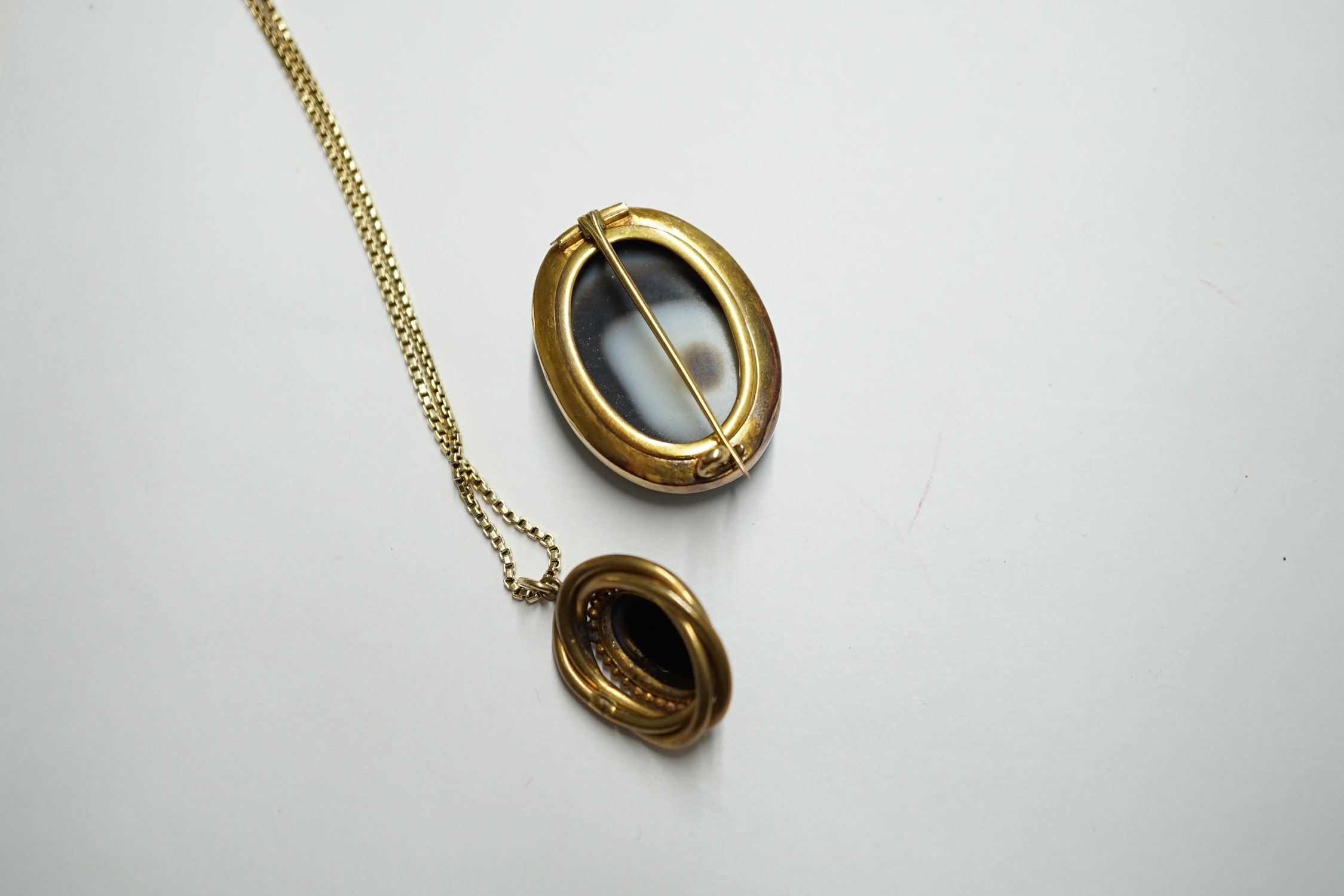 A continental yellow metal box link necklace with oval banded agate set pendant, overall 58cm and a similar brooch. Condition - fair